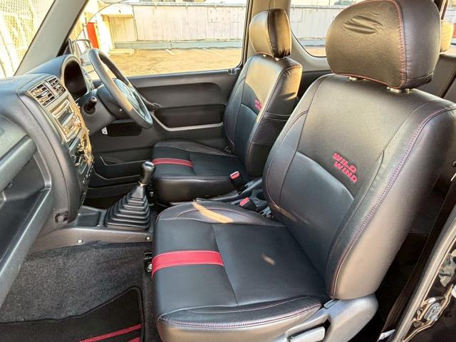 ジムニー ワイルドウインド　５速ＭＴ／パートタイム４ＷＤ／ルーフレール／背面タイヤ／シートヒーター／純正１６インチアルミ／ＣＤオーディオ／ミラーウィンカー／パワステ／パワーウィンドウ／エアコン／エアバック／革巻ステアリング（7枚目）