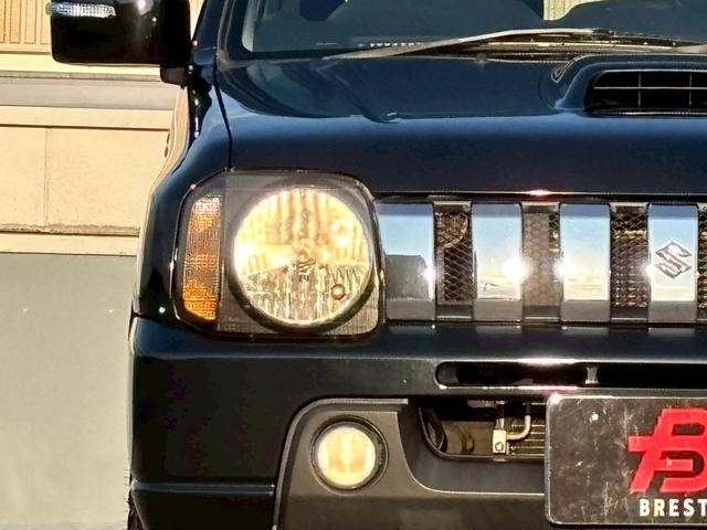 ジムニー ワイルドウインド　５速ＭＴ／パートタイム４ＷＤ／ルーフレール／背面タイヤ／シートヒーター／純正１６インチアルミ／ＣＤオーディオ／ミラーウィンカー／パワステ／パワーウィンドウ／エアコン／エアバック／革巻ステアリング（20枚目）