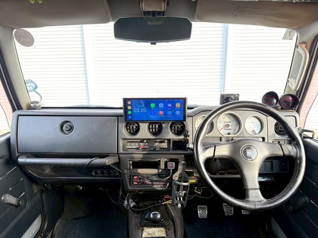 ジムニー ワイルドウインド　５速ＭＴ／パートタイム４ＷＤ／ＮＡＲＤＩ革巻ハンドル／ディスプレイオーディオ／Ｂｌｕｅｔｏｏｔｈ／ＣａｒＰｌａｙ／Ａｎｄｒｏｉｄ　Ａｕｔｏ　／バック・サイド・フロントモニター／ＪＡ２２Ｗ（5枚目）