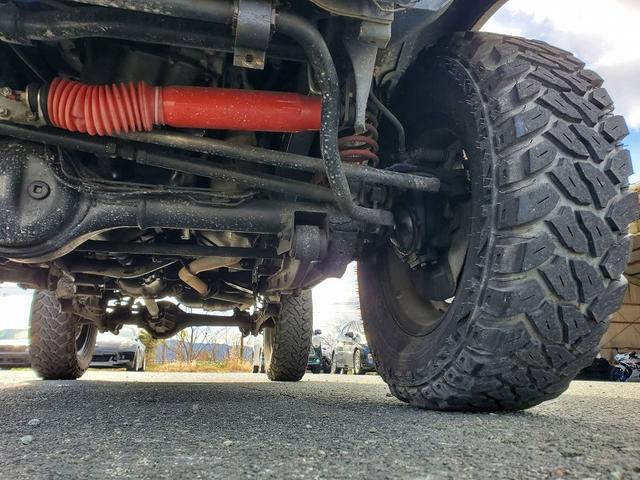 ジムニー XG リフトアップ 社外マフラー 社外バンパー 社外16インチアルミホイール ブロックタイヤ スペアタイヤ LEDテールランプ シートカバー ETC(32枚目)