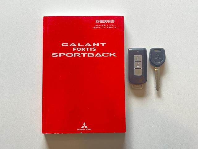 ギャランフォルティススポーツバック スポーツ バックカメラ MTモード パドルシフト 純正18インチアルミホイール キーレス ステアリモコン オートエアコン HIDヘッドライト 純正ナビ スペアキー 取扱説明書 フォグライト CD・DVD再生(26枚目)