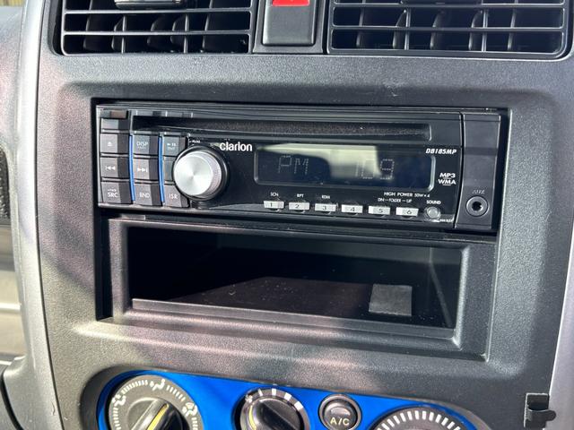 ジムニー ＸＧ　禁煙車　５速マニュアル　社外１６インチアルミ　社外マフラー　社外フロントグリル　ＣＤデッキ　キーレス　ＥＴＣ　マットガード　背面タイヤカバー　ハロゲンヘッドライト　フォグランプ　マニュアルエアコン（5枚目）