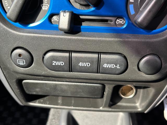 ジムニー ＸＧ　禁煙車　５速マニュアル　社外１６インチアルミ　社外マフラー　社外フロントグリル　ＣＤデッキ　キーレス　ＥＴＣ　マットガード　背面タイヤカバー　ハロゲンヘッドライト　フォグランプ　マニュアルエアコン（7枚目）