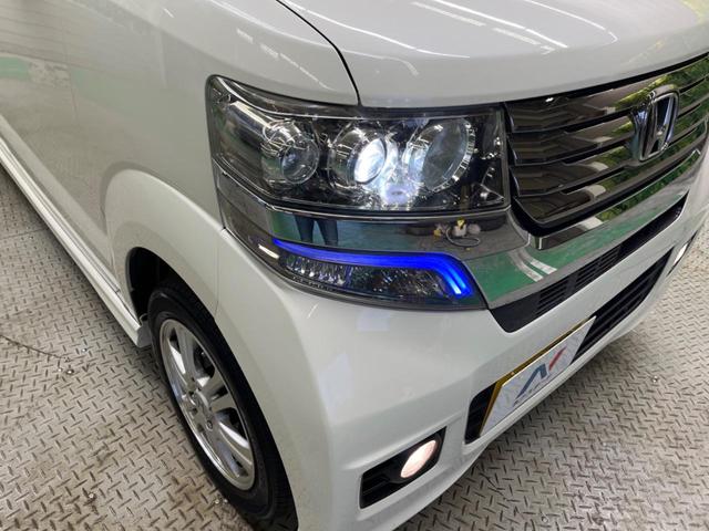 N-BOXカスタム G・Lパッケージ 禁煙車 純正ナビTV バックカメラ 電動スライドドア HIDヘッド 純正14インチAW ETC スマートキー オートエアコン オートライト ステアリングリモコン DVD再生(12枚目)