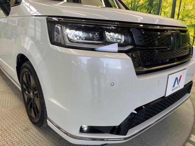 ステップワゴン ｅ：ＨＥＶスパーダ　禁煙車　純正１１．４型ナビＴＶ　マルチビューカメラ　両側電動ドア　ホンダセンシング　渋滞追従アダプティブクルーズ　電動バックドア　半革シート　シートヒーター　後席オートエアコン　後席オットマン（12枚目）