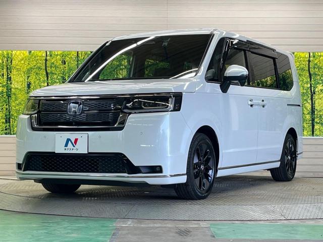 ステップワゴン ｅ：ＨＥＶスパーダ　禁煙車　純正１１．４型ナビＴＶ　マルチビューカメラ　両側電動ドア　ホンダセンシング　渋滞追従アダプティブクルーズ　電動バックドア　半革シート　シートヒーター　後席オートエアコン　後席オットマン（57枚目）