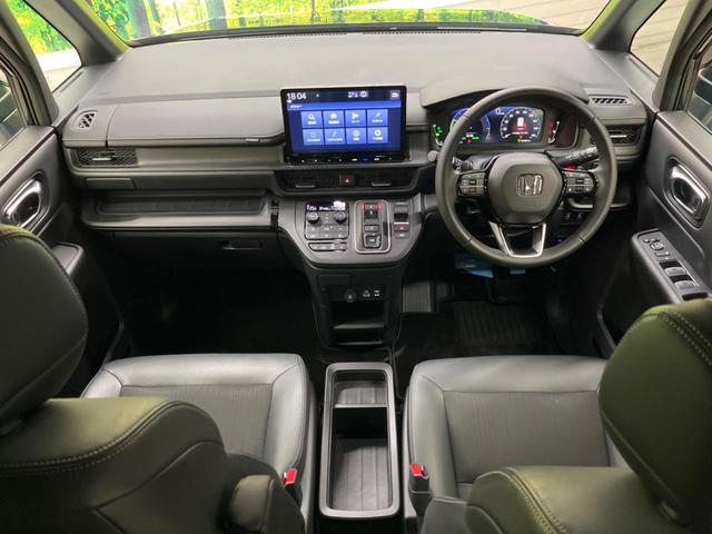 ステップワゴン ｅ：ＨＥＶスパーダ　禁煙車　純正１１．４型ナビＴＶ　純正１５．６型後席モニター　バックカメラ　ホンダセンシング　両側電動ドア　電動バックドア　渋滞追従アダプティブクルーズ　半革　シートヒーター　後席オートエアコン（2枚目）