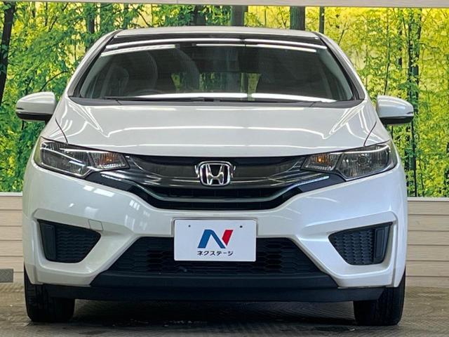 フィットハイブリッド Ｆパッケージ　禁煙車　純正ナビＴＶ　バックカメラ　ＥＴＣ　Ｂｌｕｅｔｏｏｔｈ　スマートキー　オートエアコン　オート電動格納ドアミラー　４スピーカー　ステアリングリモコン　ＤＶＤ再生（14枚目）