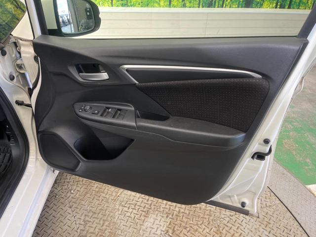 フィットハイブリッド Ｆパッケージ　禁煙車　純正ナビＴＶ　バックカメラ　ＥＴＣ　Ｂｌｕｅｔｏｏｔｈ　スマートキー　オートエアコン　オート電動格納ドアミラー　４スピーカー　ステアリングリモコン　ＤＶＤ再生（34枚目）