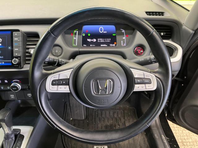 フィット ｅ：ＨＥＶホーム　禁煙車　純正９型ナビＴＶ　バックカメラ　ホンダセンシング　ＬＥＤヘッド　純正ＯＰ１６インチＡＷ　アダプティブクルーズ　パーキングセンサ　半革シート　ＥＴＣ　Ｂｌｕｅｔｏｏｔｈ　革巻ステアリング（5枚目）