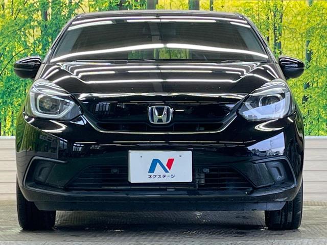フィット ｅ：ＨＥＶホーム　禁煙車　純正９型ナビＴＶ　バックカメラ　ホンダセンシング　ＬＥＤヘッド　純正ＯＰ１６インチＡＷ　アダプティブクルーズ　パーキングセンサ　半革シート　ＥＴＣ　Ｂｌｕｅｔｏｏｔｈ　革巻ステアリング（14枚目）