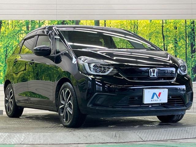 フィット ｅ：ＨＥＶホーム　禁煙車　純正９型ナビＴＶ　バックカメラ　ホンダセンシング　ＬＥＤヘッド　純正ＯＰ１６インチＡＷ　アダプティブクルーズ　パーキングセンサ　半革シート　ＥＴＣ　Ｂｌｕｅｔｏｏｔｈ　革巻ステアリング（16枚目）