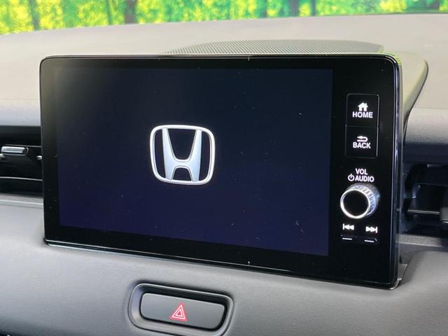 ヴェゼル ｅ：ＨＥＶ　ＲＳ　登録済未使用車　レーダークルーズ　純正９型ナビＴＶ　全周囲カメラ　衝突被害軽減　ブラインドスポットモニター　ハンズフリーパワーバックドア　ＬＥＤヘッド　オートハイビーム　シートヒーター　置くだけ充電（3枚目）