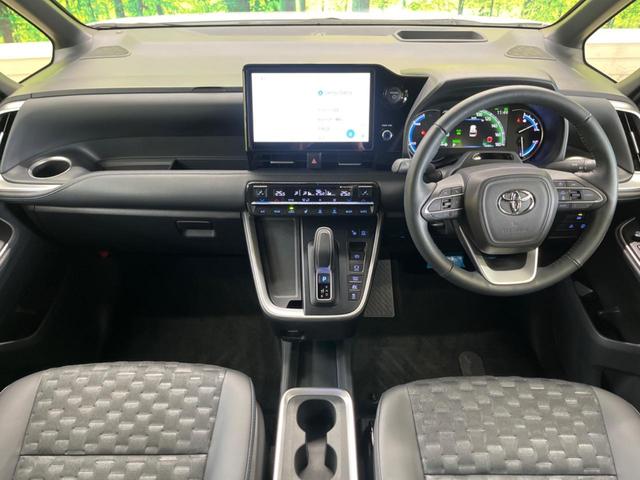 ヴォクシー ハイブリッドＳ－Ｚ　快適利便ＰＫＧ　禁煙車　純正１０．５型ナビＴＶ　純正１４型後席モニター　三眼ＬＥＤ　パノラミックビューモニタ　ブラインドスポットモニタ　前中列シートヒーター　電動バックドア　後席オットマン　ＤＶＤ再生（2枚目）