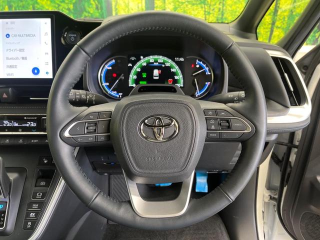 ヴォクシー ハイブリッドＳ－Ｚ　快適利便ＰＫＧ　禁煙車　純正１０．５型ナビＴＶ　純正１４型後席モニター　三眼ＬＥＤ　パノラミックビューモニタ　ブラインドスポットモニタ　前中列シートヒーター　電動バックドア　後席オットマン　ＤＶＤ再生（6枚目）