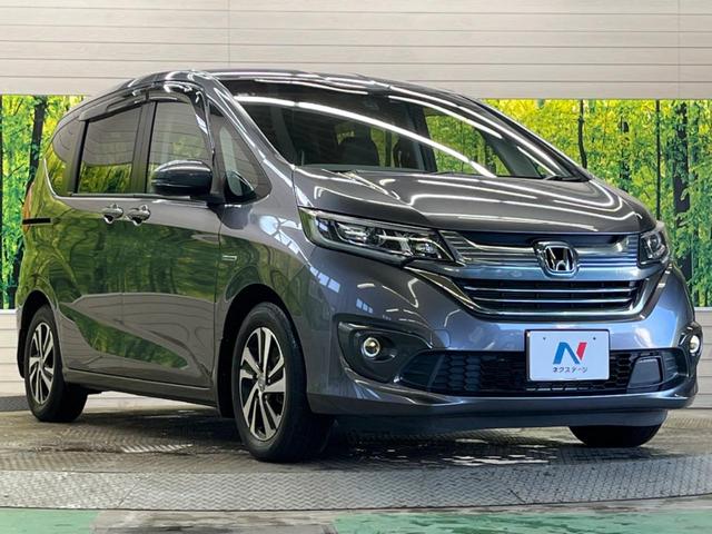 フリード＋ハイブリッド ハイブリッドＥＸ　禁煙車　純正９型ナビＴＶ　両側電動ドア　バックカメラ　ホンダセンシング　アダプティブクルーズ　ＬＥＤヘッド　純正１５インチＡＷ　半革シート　シートヒーター　革巻ステアリング　ＥＴＣ　ＤＶＤ再生（16枚目）