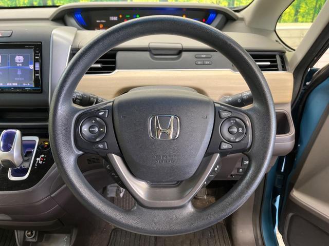 フリードハイブリッド ハイブリッド・Ｇホンダセンシング　Ｃパッケージ　７人乗　禁煙車　純正ナビフルセグ　フリップダウンモニター　両側電動ドア　バックカメラ　ＬＥＤヘッド　ＥＴＣ　Ｂｌｕｅｔｏｏｔｈ　後席サンシェード　スマートキー　オートエアコン　ＤＶＤ再生（6枚目）