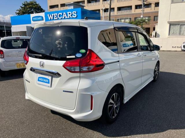 フリードハイブリッド ハイブリッドEX 新品タイヤ/純正エアロ/保証書/純正 SDナビ/ホンダセンシング/両側電動スライドドア/シートヒーター 前席/車線逸脱防止支援システム/シート ハーフレザー/ヘッドランプ LED 衝突被害軽減システム(3枚目)