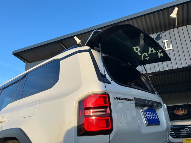 ランドクルーザー２５０ ＶＸ　モデリスタパッケージ　プロテクションフィルム　シグネチャーイルミ　レザーパワーシート　サンルーフ　クルーズコントロール　ＪＢＬ　アラウンドビューモニタ　Ｂｌｕｅｔｏｏｔｈ　ＥＴＣ２．０　パワートランク（56枚目）