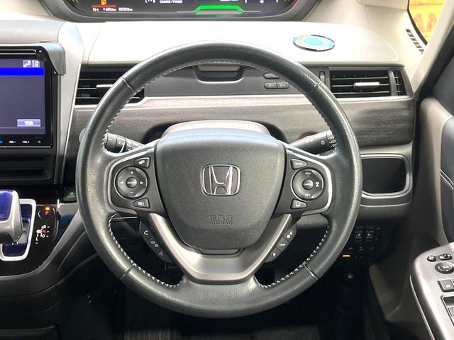 フリードハイブリッド ハイブリッド・ＥＸ　両側電動スライドドア　フリップダウンモニター　バックカメラ　ホンダセンシング　レーダークルーズコントロール　禁煙車　ハーフレザーシート　ドライブレコーダー　コーナーセンサー　前席シートヒーター　ＥＴＣ（12枚目）