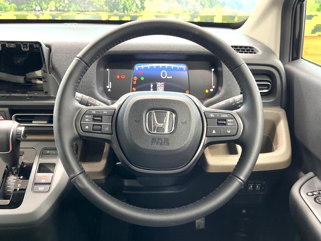 フリード エアー　ＥＸ　登録済未使用車　両側電動ドア　ホンダセンシング　レーダークルーズ　ハーフレザーシート　前席シートヒーター　コーナーセンサー　スマートキー　ＬＥＤヘッド　純正１５インチアルミ　ブラインドスポットモニター（11枚目）