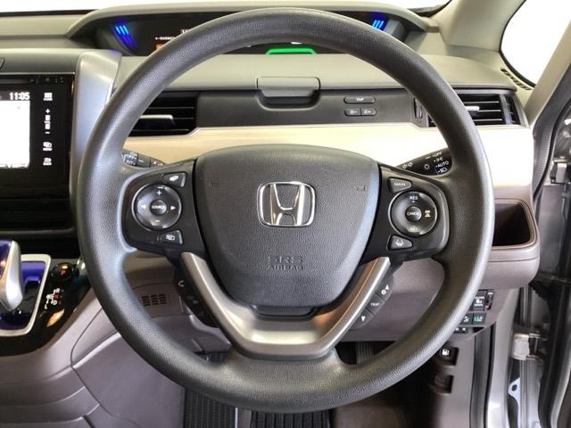 フリードハイブリッド ハイブリッド・Ｇホンダセンシング　６人乗り　ワンオーナー車　メモリーナビ　フルセグ　Ｂｌｕｅｔｏｏｔｈ　バックカメラ　ＥＴＣ　オートライト機能付ＬＥＤヘッドライト　シートヒーター　両側電動スライドドア　光触媒抗菌消臭施工済　スマキー（11枚目）
