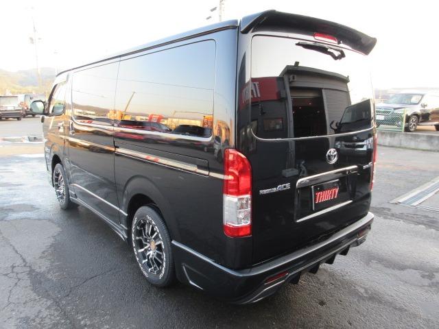 ハイエースバン スーパーGL ダークプライム 1オーナー 4WD 寒冷地仕様 社外ナビ Bカメラ 両側パワースライド モデリスタエアロ 社外エアロ 純正ルーフスポイラー ETC H20ホワイトレター LEDヘッドライト 前側フォグ AC100V(15枚目)