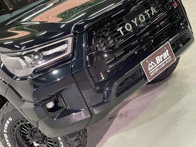 ハイラックス Ｚ　ＧＲスポーツ　リフトアップ　減衰調整式ショック　ＫＭＣ／ＡＺＴＥＣ新品アルミホイール　ＴＯＹＯオープンカントリー新品タイヤ　トノカバー　ベッドライナ　ディスプレイオーディオ　全方位カメラ　クルコン　ＥＴＣ２．０（68枚目）