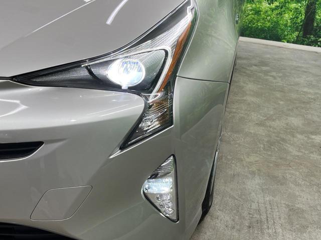 プリウス S 4WD 純正SDナビ バックカメラ 寒冷地仕様 禁煙車 スマートキー LEDヘッド ビルトインETC オートライト デュアルエアコン 純正16インチアルミ Bluetooth CD DVD再生(11枚目)