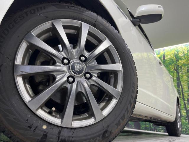 フィットハイブリッド シーズ ファインスタイル 純正ナビ バックカメラ 禁煙車 ETC Bluetooth スマートキー シートヒーター HIDヘッド クルーズコントロール オートライト ステアリングスイッチ 15インチアルミ CD ワンセグ(13枚目)