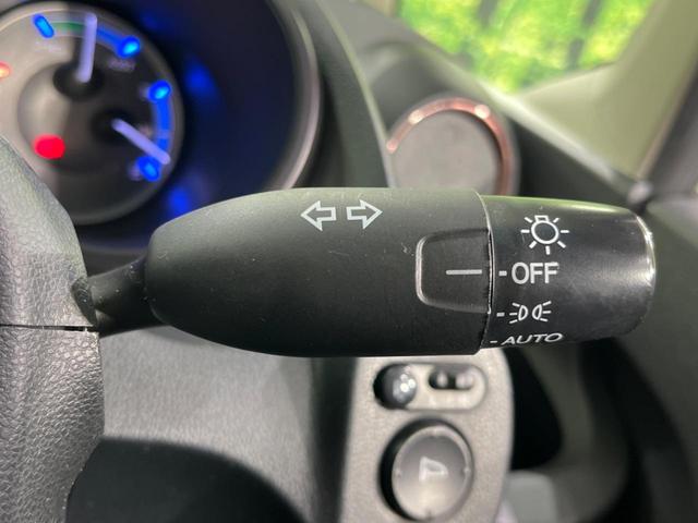 フィットハイブリッド シーズ ファインスタイル 純正ナビ バックカメラ 禁煙車 ETC Bluetooth スマートキー シートヒーター HIDヘッド クルーズコントロール オートライト ステアリングスイッチ 15インチアルミ CD ワンセグ(30枚目)