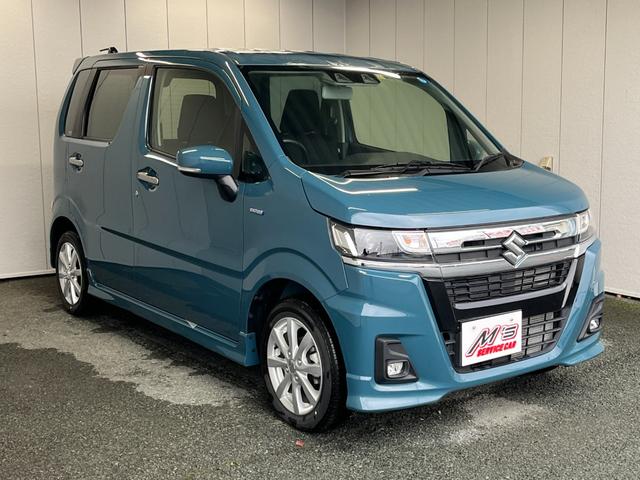 ワゴンＲカスタムＺ ハイブリッドＺＸ　４ＷＤ　届出済未使用車　衝突被害軽減ブレーキ　シートヒーター　クリアランスソナー　レーンアシスト　クルコン　ＬＥＤライト　ステリモ　オートライト　純正１４ＡＷ（4枚目）