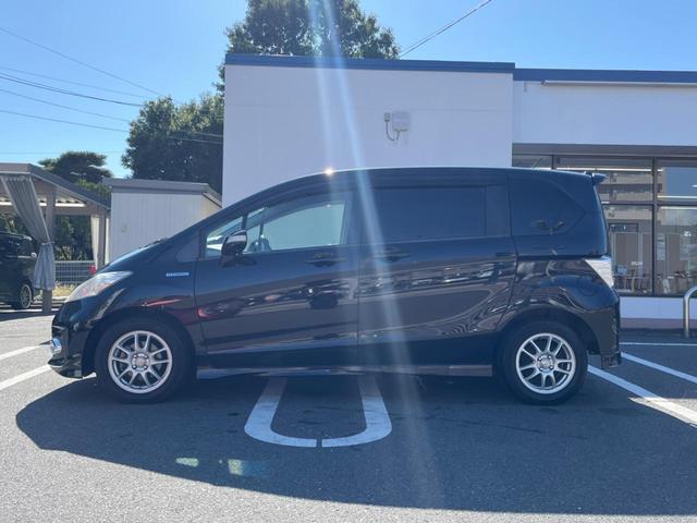 フリードハイブリッド ジャストセレクション フリップダウンモニター 助手席側パワースライドドア 純正ナビ バックカメラ ドライブレコーダー ETC スマートキー オートライト オートエアコン クルーズコントロール HIDヘッドライト(26枚目)