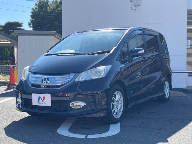 フリードハイブリッド ジャストセレクション フリップダウンモニター 助手席側パワースライドドア 純正ナビ バックカメラ ドライブレコーダー ETC スマートキー オートライト オートエアコン クルーズコントロール HIDヘッドライト(28枚目)