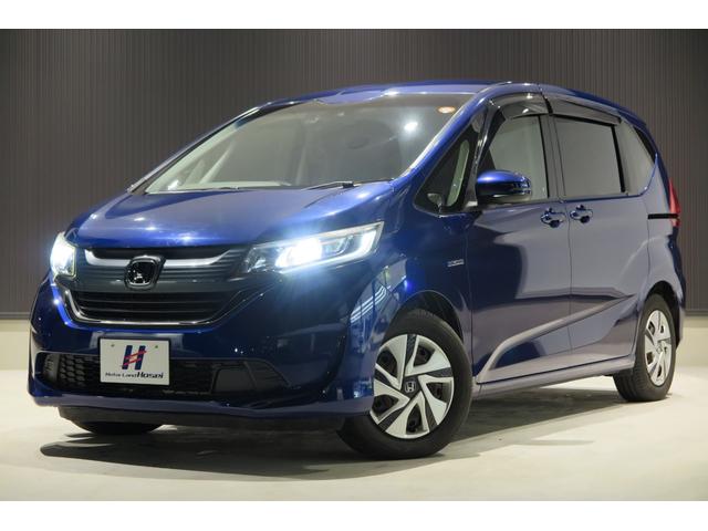 フリードハイブリッド ハイブリッド・Ｇホンダセンシング　木目調パネル　ヒーテッドドアミラー　ステアリモコン　ＬＥＤオートライト　プッシュスタート　ＴＶジャンパー　ホンダセンシング　レーンキープ　ＬＫＡＳ　アダプティブクルーズコントロール　ＥＣＯＮ（2枚目）