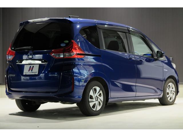 フリードハイブリッド ハイブリッド・Ｇホンダセンシング　木目調パネル　ヒーテッドドアミラー　ステアリモコン　ＬＥＤオートライト　プッシュスタート　ＴＶジャンパー　ホンダセンシング　レーンキープ　ＬＫＡＳ　アダプティブクルーズコントロール　ＥＣＯＮ（64枚目）