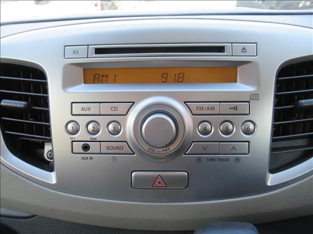 ワゴンＲ ＦＸ　４ＷＤ　禁煙車　純正ＣＤオーディオ　シートヒーター　電動格納ヒーテッドドアミラー　ヘッドライトレベライザー　エネチャージ　アイドリングストップ　バニティーミラー　オートエアコン　社外１４インチアルミ（5枚目）