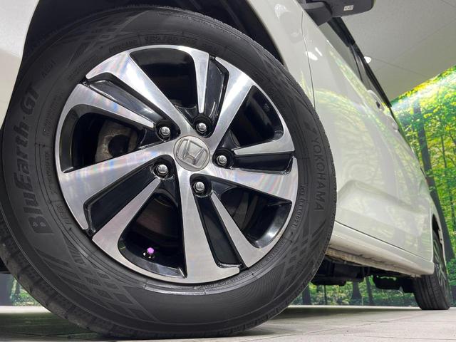 フリード G・ホンダセンシング 4WD 衝突軽減 禁煙車 両側電動ドア 純正9インチナビ バックカメラ アダプティブクルーズコントロール 前席シートヒーター ETC bluetooth  純正15インチアルミホイール 車線逸脱警報(15枚目)