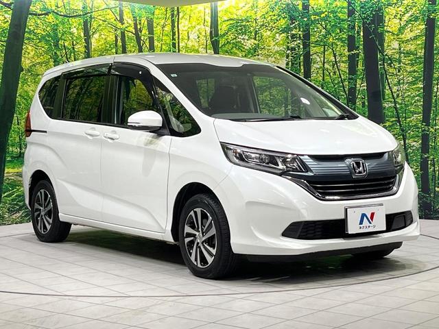 フリード G・ホンダセンシング 4WD 衝突軽減 禁煙車 両側電動ドア 純正9インチナビ バックカメラ アダプティブクルーズコントロール 前席シートヒーター ETC bluetooth  純正15インチアルミホイール 車線逸脱警報(18枚目)