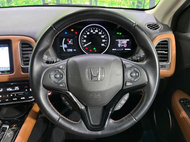 ヴェゼル ハイブリッドＺ・ホンダセンシング　４ＷＤ　禁煙車　衝突軽減　無限フルエアロ　純正ナビ　レーダークルーズ　バックカメラ　ＥＴＣ　前席シートヒーター　寒冷地仕様　前席パワーシート　オートライト　オートエアコン　オートハイビーム（12枚目）