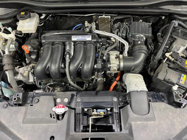 ヴェゼル ハイブリッドＺ・ホンダセンシング　４ＷＤ　禁煙車　衝突軽減　無限フルエアロ　純正ナビ　レーダークルーズ　バックカメラ　ＥＴＣ　前席シートヒーター　寒冷地仕様　前席パワーシート　オートライト　オートエアコン　オートハイビーム（19枚目）