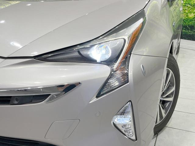 プリウス Ａプレミアム　４ＷＤ　セーフティセンス　禁煙車　純正ＳＤナビ　黒革シート　レーダークルーズ　バックカメラ　ＥＴＣ　Ｂｌｕｅｔｏｏｔｈ　フルセグ　スマートキー　シートヒーター　パワーシート　ＬＥＤヘッドライト（12枚目）