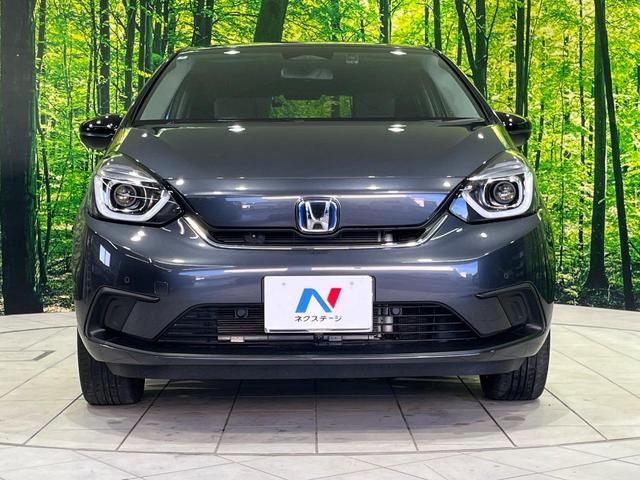 フィット ｅ：ＨＥＶホーム　２０周年特別仕様車　カーサ　４ＷＤ　純正９型ＳＤナビ　バックカメラ　寒冷地仕様　ホンダセンシング　アダプティブクルーズ　禁煙車　ドラレコ　コーナーセンサー　スマートキー　ＬＥＤヘッド　ビルトインＥＴＣ　オートハイビーム（14枚目）