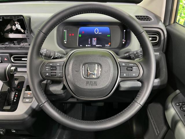 フリード ｅ：ＨＥＶクロスター　４ＷＤ　登録済未使用車　両側電動スライド　ホンダセンシング　アダプティブクルーズ　ハーフレザーシート　クリアランスソナー　スマートキー　ＬＥＤヘッド　純正１５インチＡＷ　オートハイビーム　オートライト（12枚目）