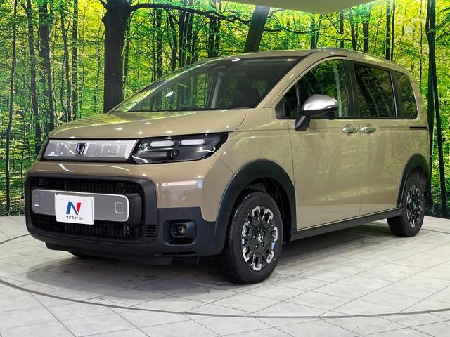 フリード ｅ：ＨＥＶクロスター　４ＷＤ　登録済未使用車　両側電動スライド　ホンダセンシング　アダプティブクルーズ　ハーフレザーシート　クリアランスソナー　スマートキー　ＬＥＤヘッド　純正１５インチＡＷ　オートハイビーム　オートライト（25枚目）