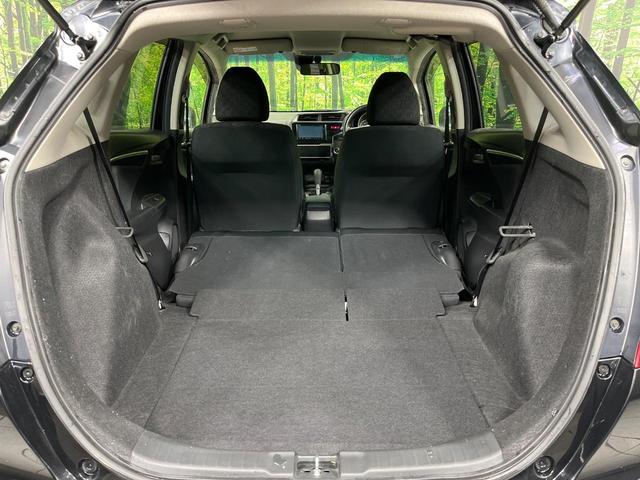 フィット １３Ｇ・Ｓパッケージ　４ＷＤ　禁煙車　純正ナビ　バックカメラ　衝突軽減装置　ＥＴＣ　ＬＥＤヘッド　オートライト　純正１５インチアルミ　オートエアコン　ステアリングスイッチ　Ｂｌｕｅｔｏｏｔｈ再生　電動格納ミラー（11枚目）