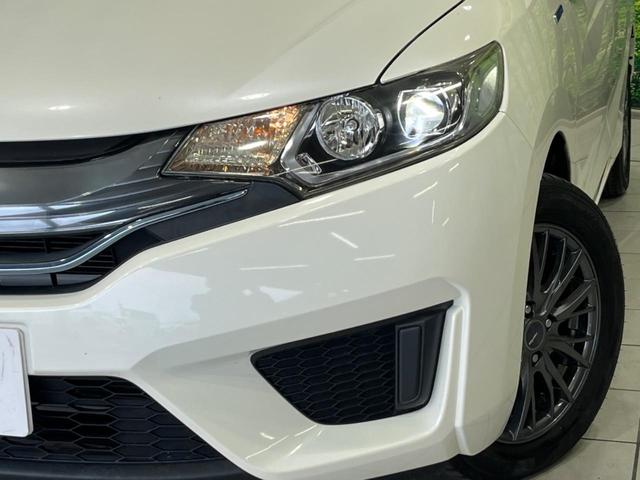 フィットハイブリッド Ｌパッケージ　純正ナビ　バックカメラ　衝突軽減装置　禁煙車　ハーフレザーシート　スマートキー　ＬＥＤヘッド　ＥＴＣ　クルコン　誤発進抑制機能　オートライト　オートエアコン　Ｂｌｕｅｔｏｏｔｈ　ＣＤ　ＤＶＤ再生（12枚目）