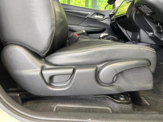フィットハイブリッド Ｌパッケージ　純正ナビ　バックカメラ　衝突軽減装置　禁煙車　ハーフレザーシート　スマートキー　ＬＥＤヘッド　ＥＴＣ　クルコン　誤発進抑制機能　オートライト　オートエアコン　Ｂｌｕｅｔｏｏｔｈ　ＣＤ　ＤＶＤ再生（58枚目）