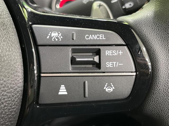 N-BOXカスタム ターボ 両側電動ドア 全周囲カメラ 衝突軽減装置 レーダークルーズ 禁煙車 ハーフレザーシート コーナーセンサー レーンキープ スマートキー LEDヘッド ETC オートハイビーム 純正15インチAW(7枚目)