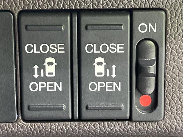 フリード G・ホンダセンシング 両側電動ドア 純正9型ナビ 後席モニター バックカメラ 寒冷地仕様 衝突軽減装置 レーダークルーズ 禁煙車 レーンキープ スマートキー LEDヘッド ETC 誤発進抑制機能 先行車発進告知 DVD再生(3枚目)